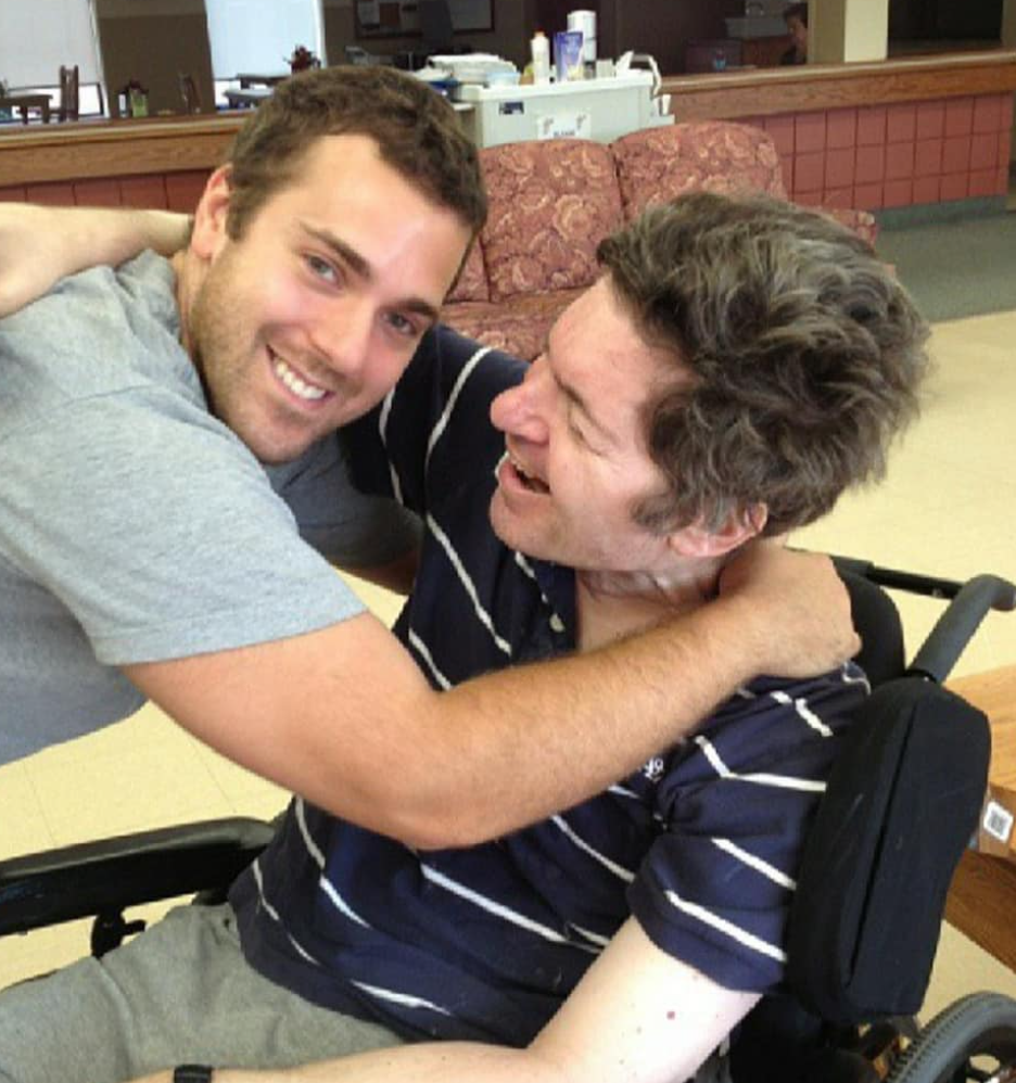 Alex embracing his dad